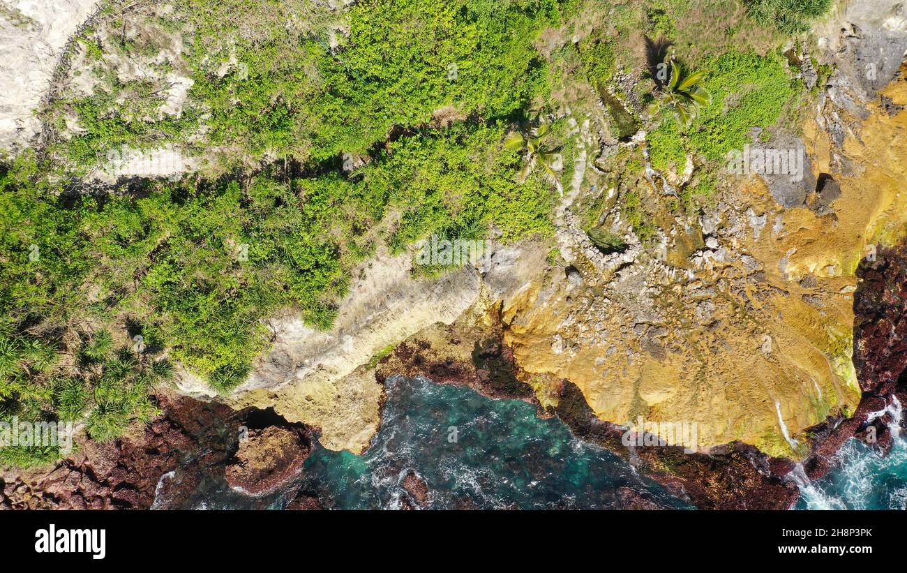 Dangerous wooden walkway hanging alongside a vertical cliff Extremely