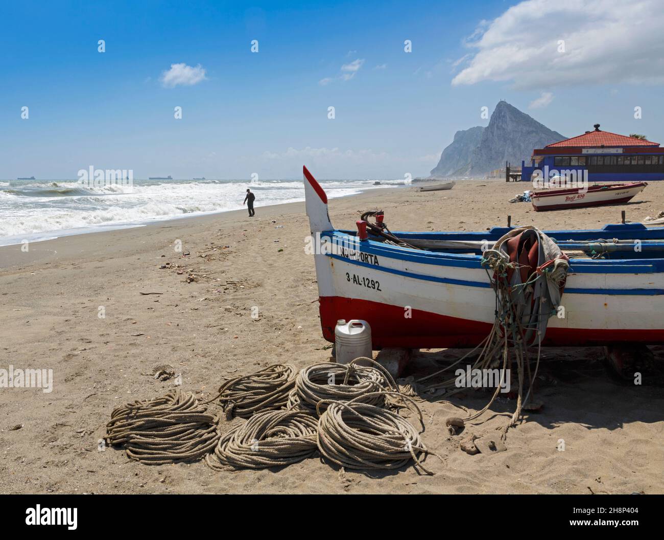 La Linea de la Concepcion, Cadiz Province, Andalulusia, southern Spain.  Fishing boats on Playa de Atunara.  Atunara beach.  Rock of Gibraltar at end Stock Photo