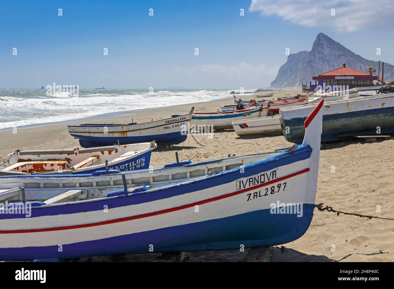 La Linea de la Concepcion, Cadiz Province, Andalulusia, southern Spain.  Fishing boats on Playa de Atunara.  Atunara beach.  Rock of Gibraltar at end Stock Photo