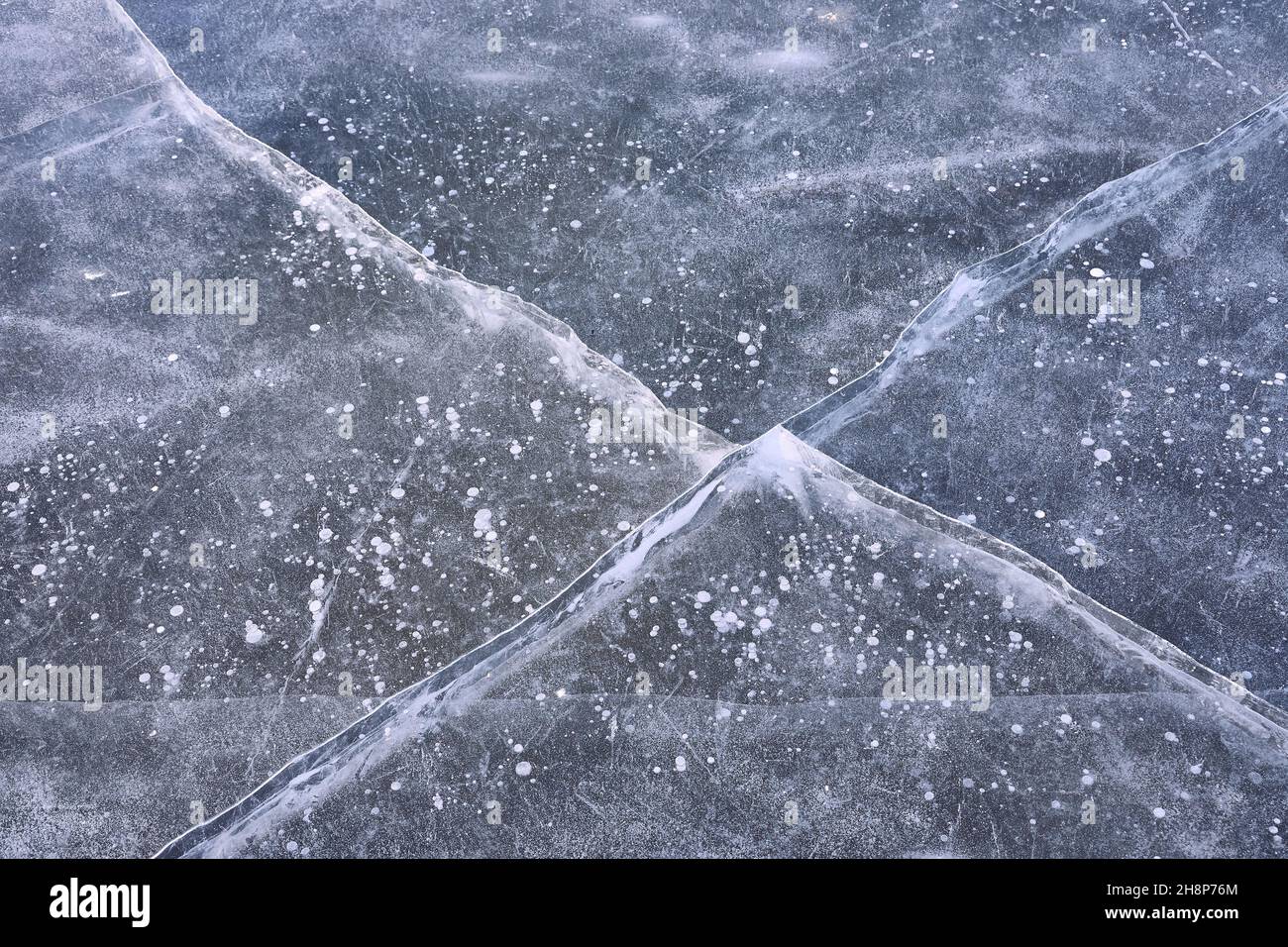 Winter ice with cracks Stock Photo
