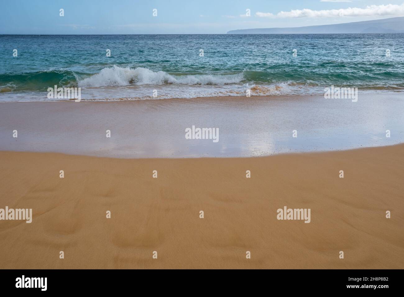 A soft, fine, sandy beach while talking a walk in Makena State Park Stock Photo