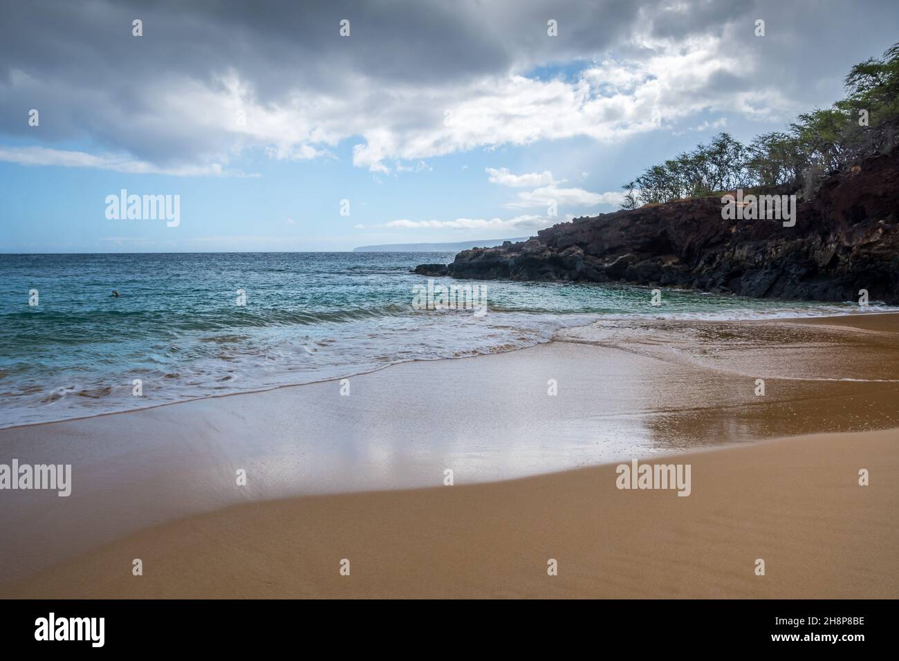 A soft, fine, sandy beach while talking a walk in Makena State Park Stock Photo