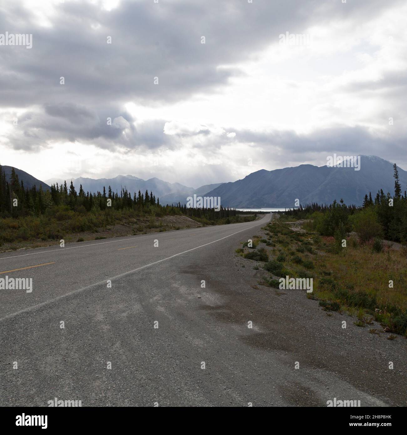 The Alaska Highway in the Yukon, Canada. The road runs towards Kluane Lake and Mount Wallace. Stock Photo