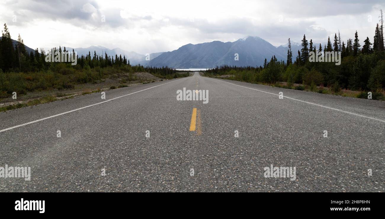 The Alaska Highway in the Yukon, Canada. The road runs towards Kluane Lake. Stock Photo