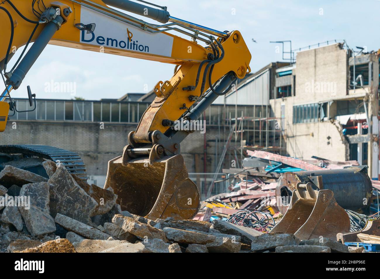 Close-up of hydraulic arm clearing rubble on demolition site Stock Photo