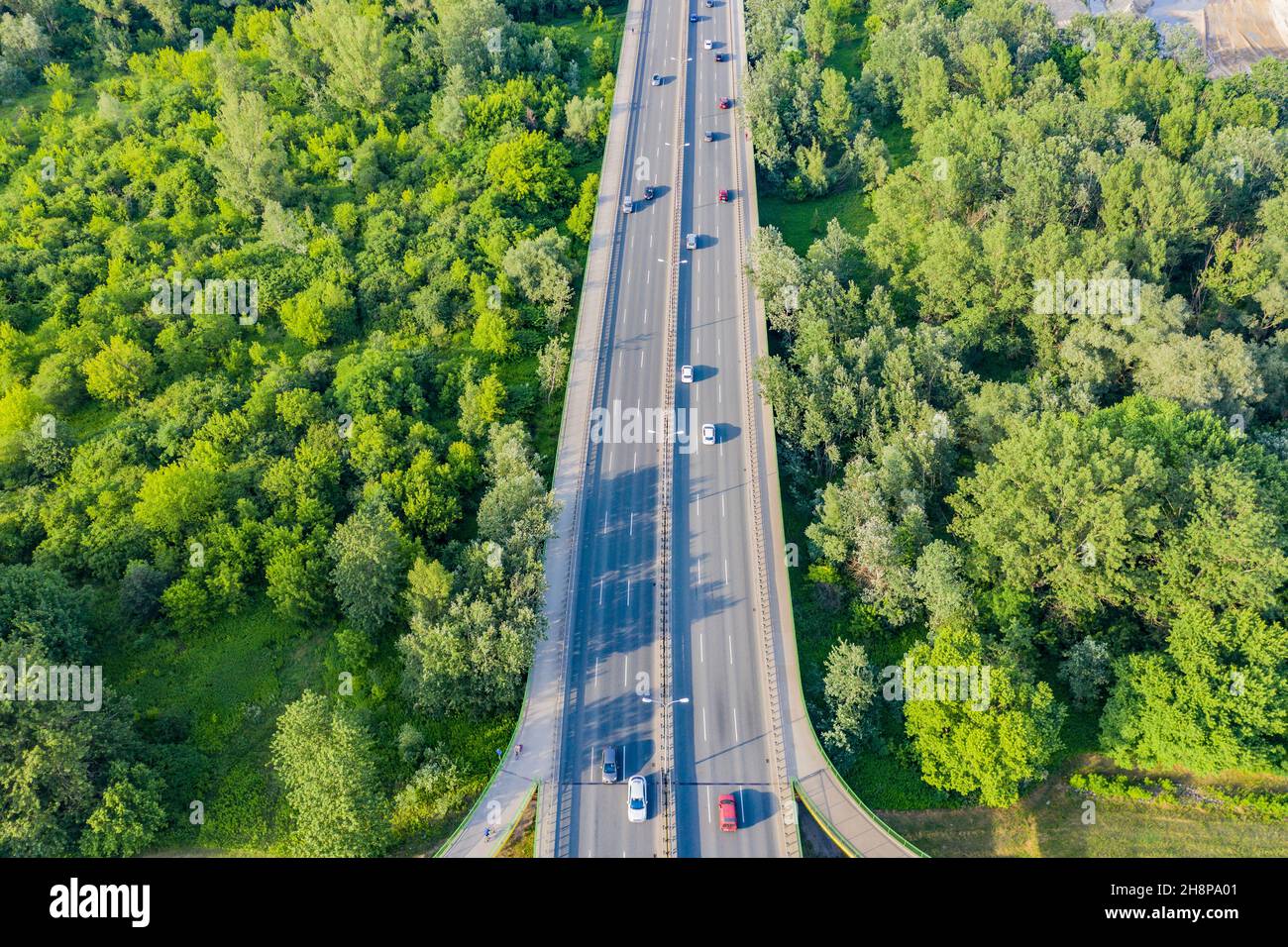 Aerial Drone Flight top down View of freeway busy city rush hour heavy traffic jam highway. Aerial view of the vehicular intersection, traffic at peak Stock Photo