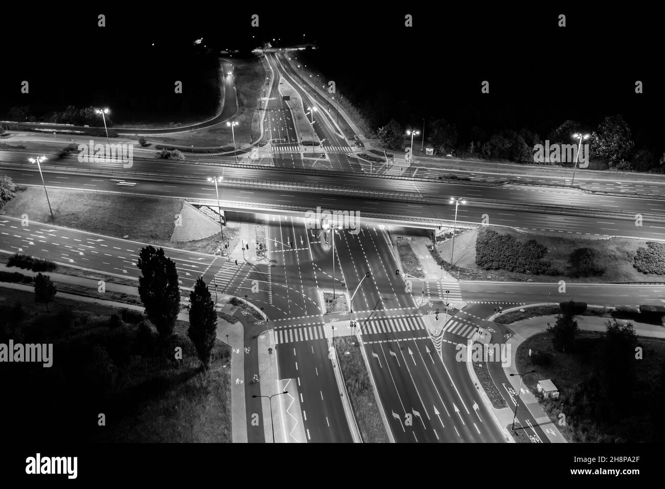 Aerial view at junctions of city highway. Vehicles drive on road Stock Photo