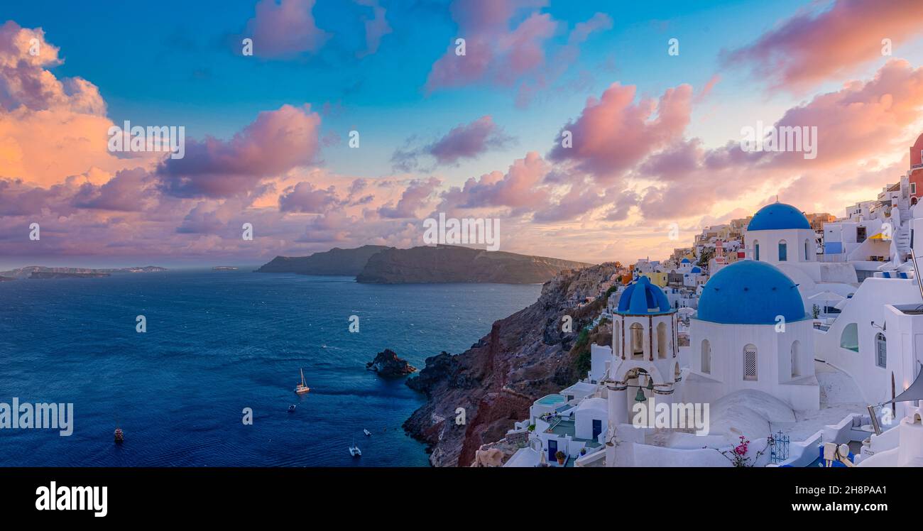 Fantastic sunset landscape of famous travel and vacation destination. Luxury summer adventure concept. Wonderful view of Oia village, Santorini Greece Stock Photo