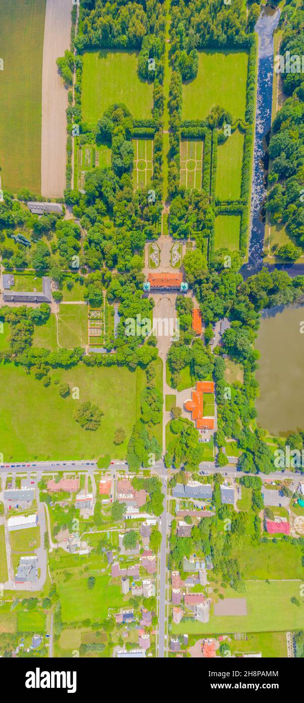 Aerial panorama of Beautiful avenue of trees in the grounds of Nieborow Palace, a Baroque style residence in Poland. Colourful French-design garden Stock Photo