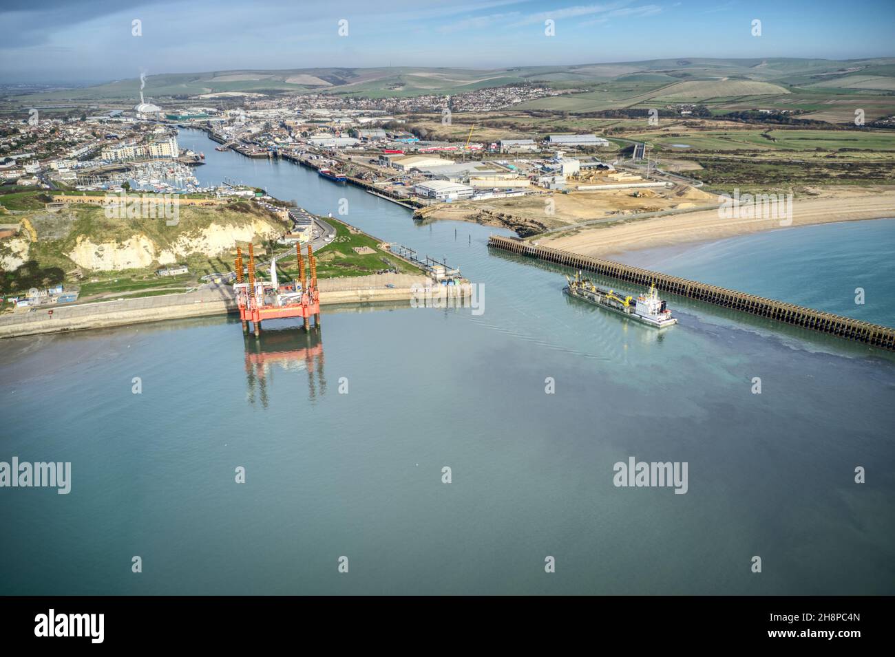 A Hopper dredger in Newhaven Bay before entering the port and the River Ouse. Aerial photo, Stock Photo