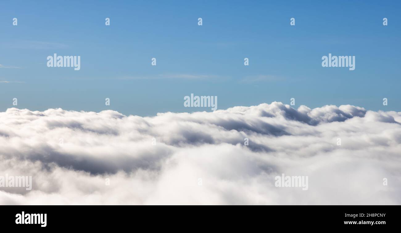 White Puff Clouds during a sunny day. Stock Photo