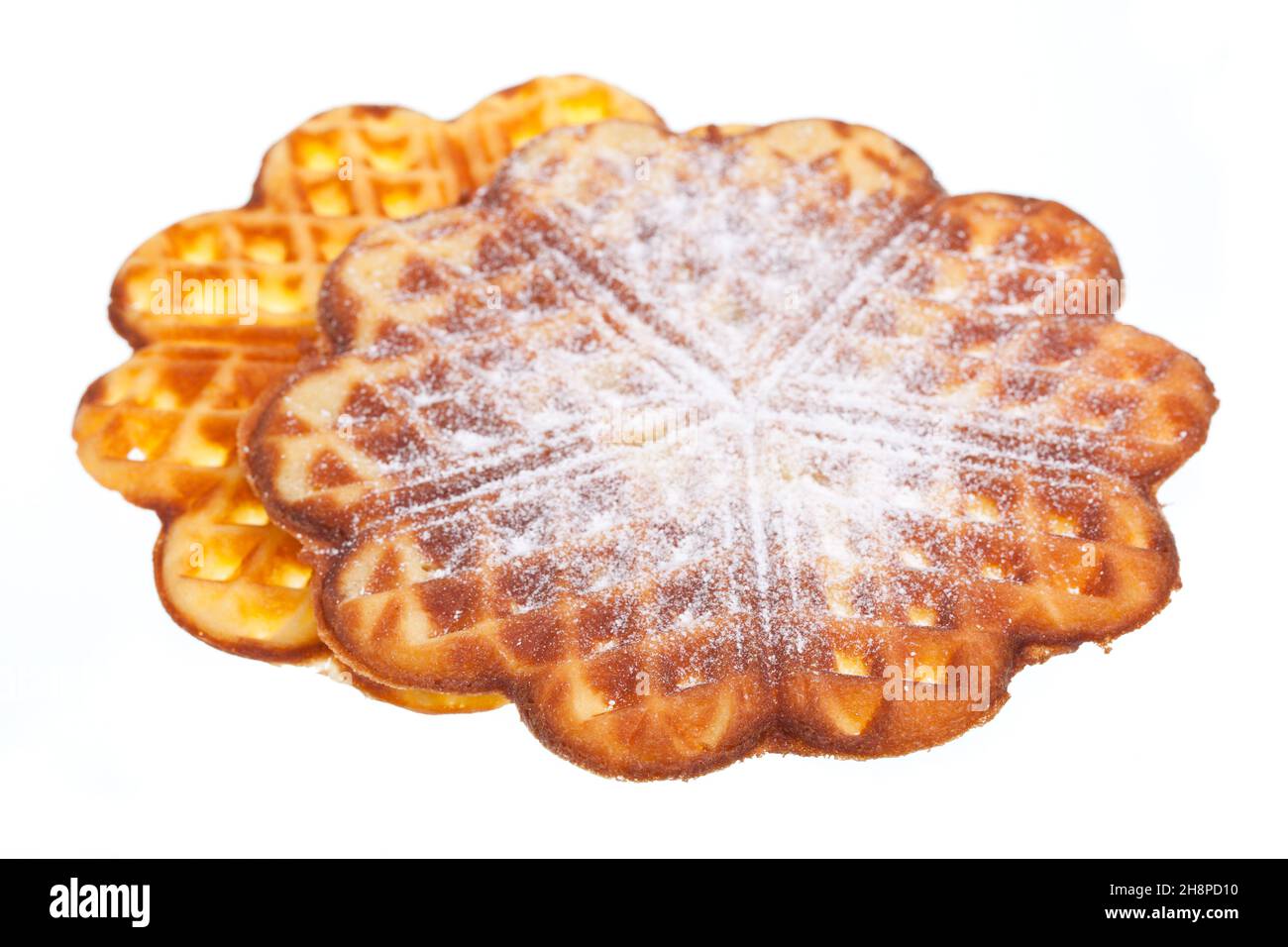Two sweet waffles with powdered sugar dough, about each other, sugar, powdered sugar Stock Photo