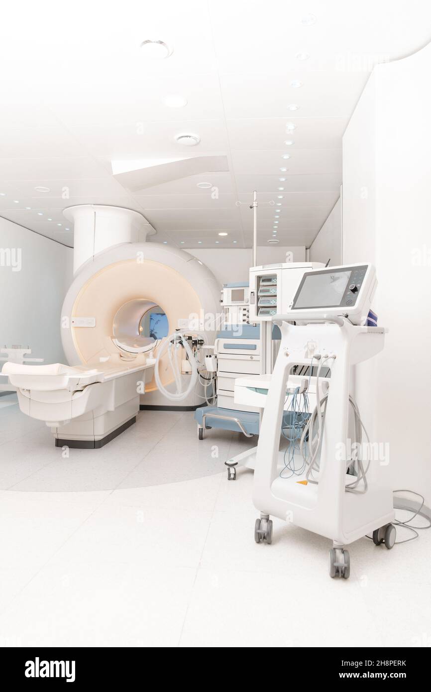 Medical CT or MRI Scan in the modern hospital laboratory. Interior of radiography department. Technologically advanced equipment in white room Stock Photo
