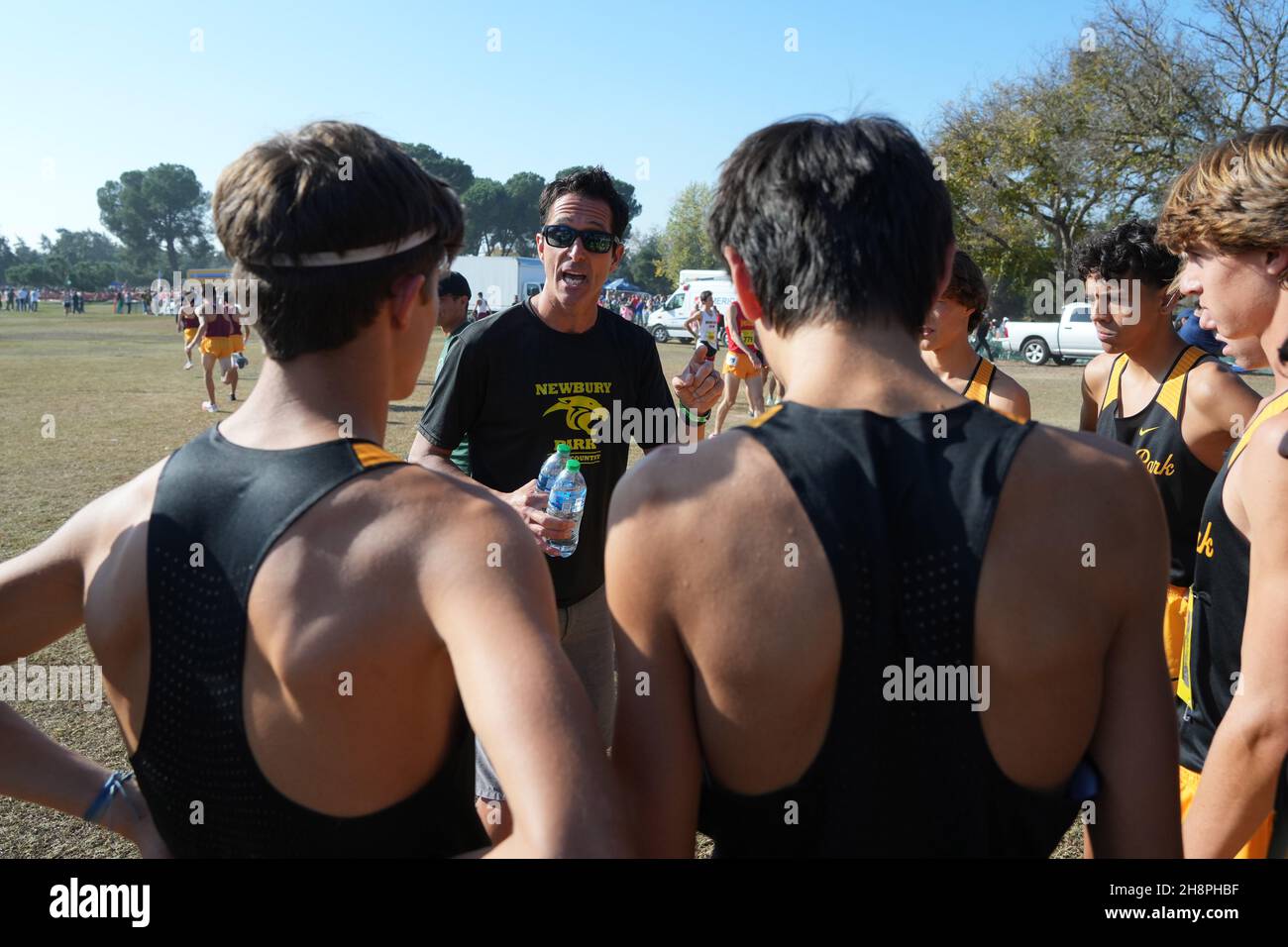 Newbury Park Panthers coach Sean Brosnan talks to runners before the start of the boys Division I race during the CIF State Cross Country Championships at Woodward Park, Saturday, Nov. 27, 2021, in Fresno, Calif. Stock Photo