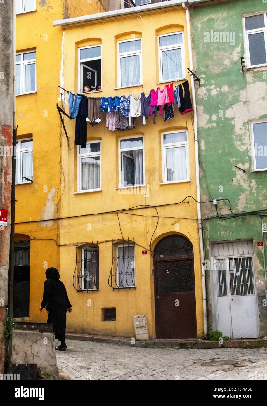 Daily Life In Istanbul. Drying cloths between two buildings in Balat.  It's a traditional method in the narrow streets of Istanbuls historical area Stock Photo