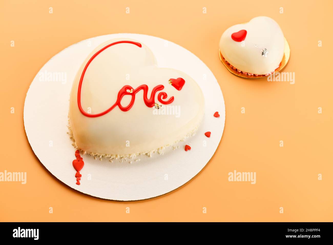 Mousse Heart shaped cake with the inscription love and small ...