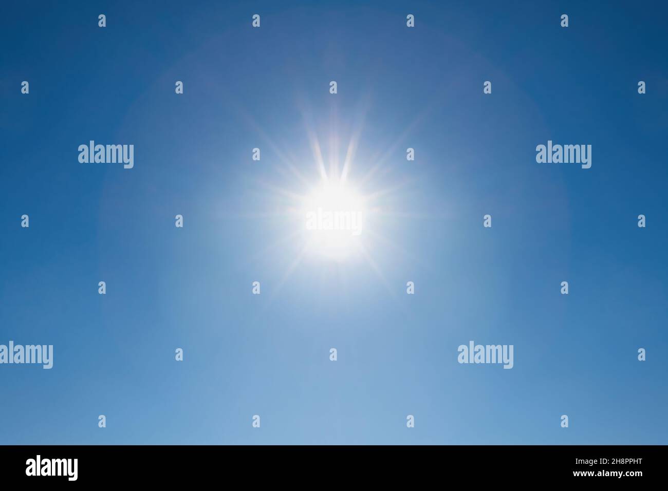 Sun in a clear blue sky for background Stock Photo