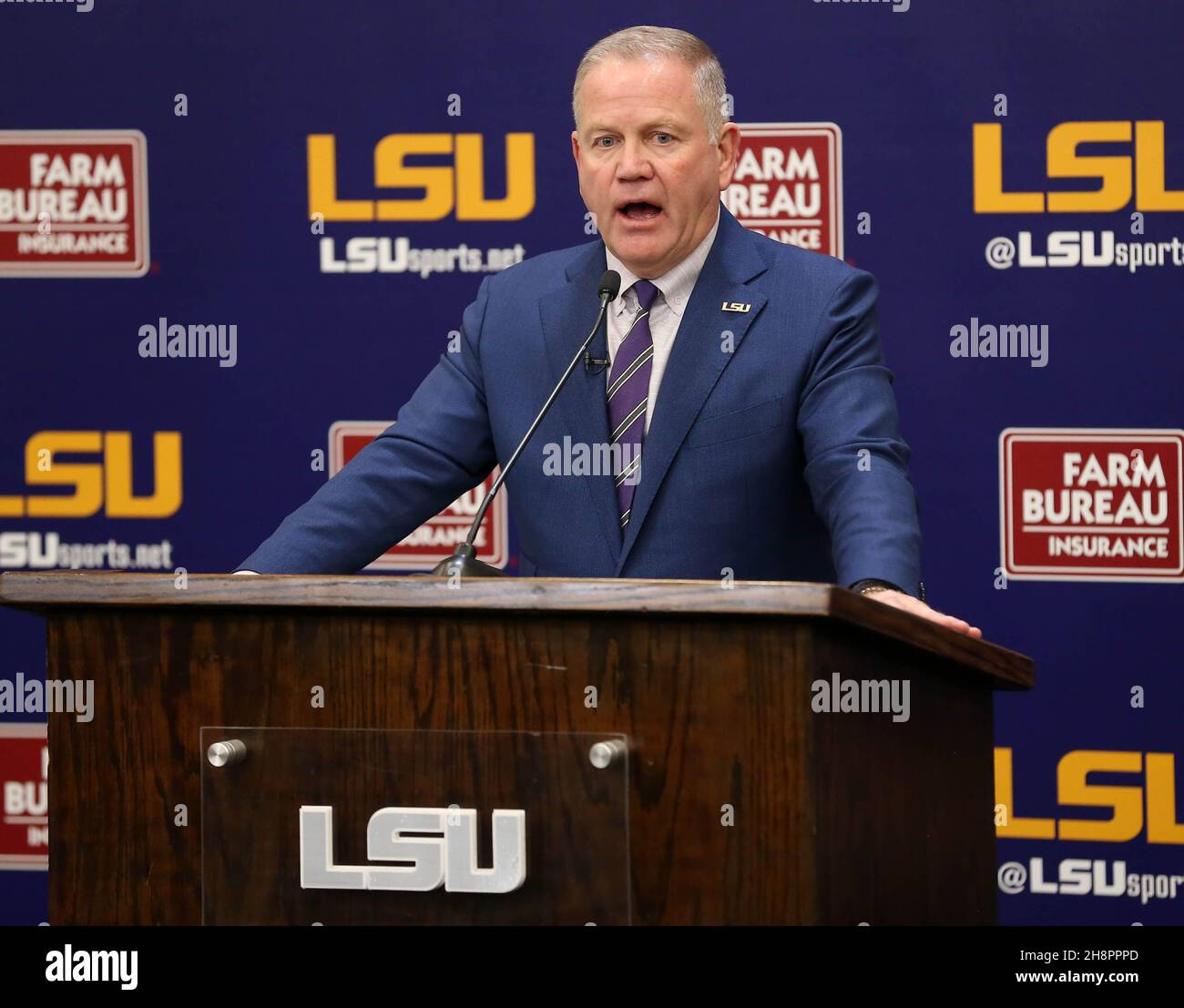 Notre Dame Liam Eichenberg slaps hands with head coach Brian Kelly