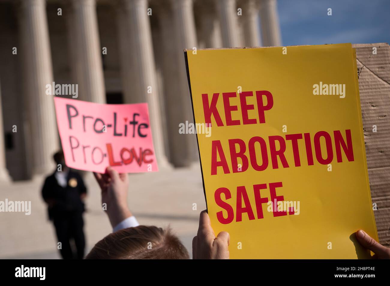 Washington, USA. 01st Dec, 2021. Abortion rights and anti-abortion demonstrators hold signs outside the U.S. Supreme Court while the court holds a hearing on a Mississippi abortion ban, in Washington, DC, on Wednesday, December 1, 2021. With a government shutdown approaching on Friday, Congress is working to put together a short-term spending compromise while Democrats continue to negotiate President Biden's Build Back Better agenda in a hectic December on the Hill. (Graeme Sloan/Sipa USA) Credit: Sipa USA/Alamy Live News Stock Photo