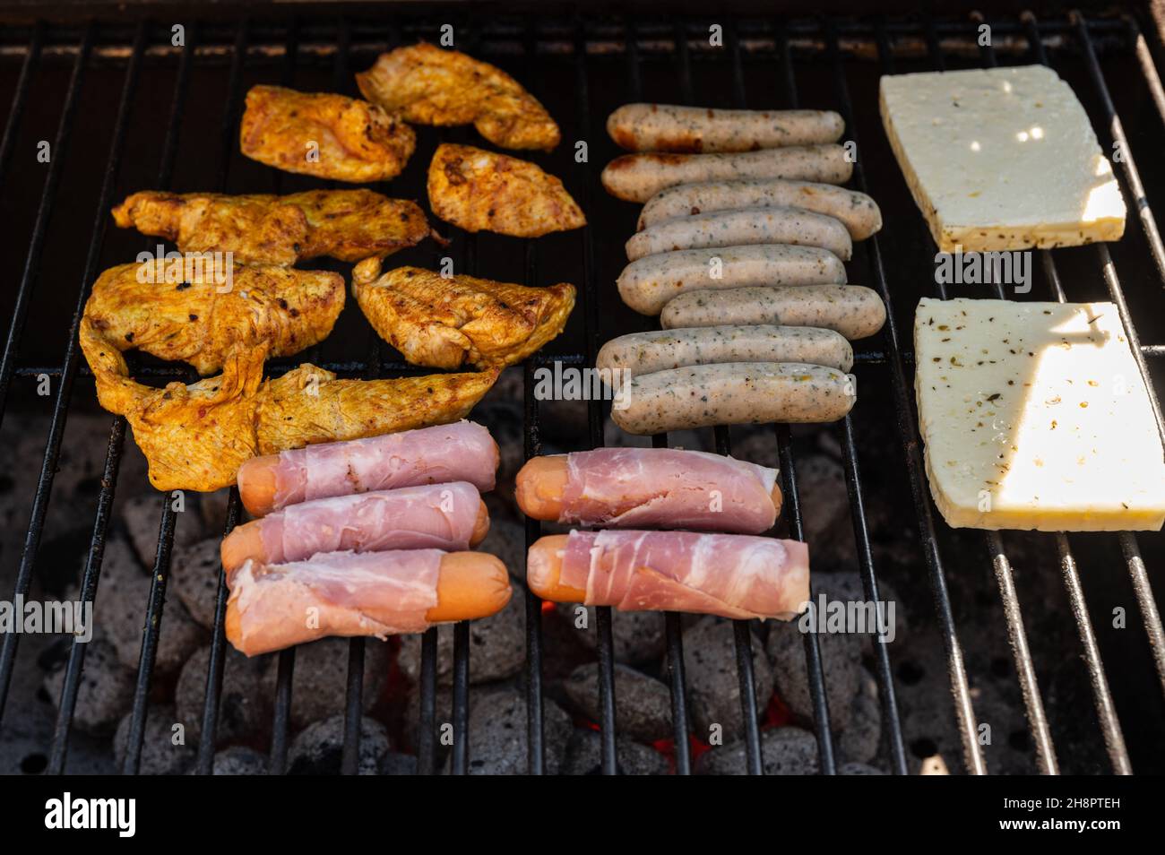 Preparing meat and cheese for dinner on the grill Stock Photo Alamy