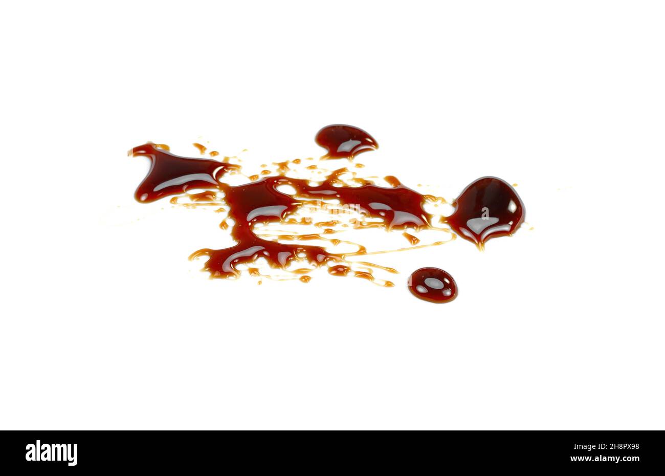 Pomegranate sauce dressing isolated on white. Pomegranate syrup puddle ...