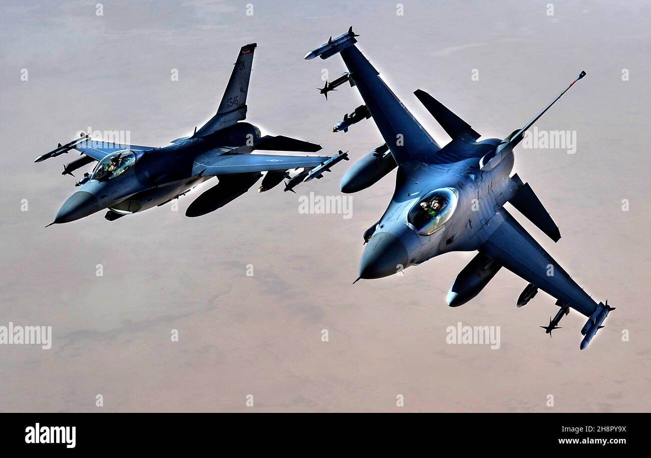 U.S. Air Force F-16 Fighting Falcon aircraft fly in formation after aerial refueling during a sortie November 9, 2011 over Iraq. Stock Photo