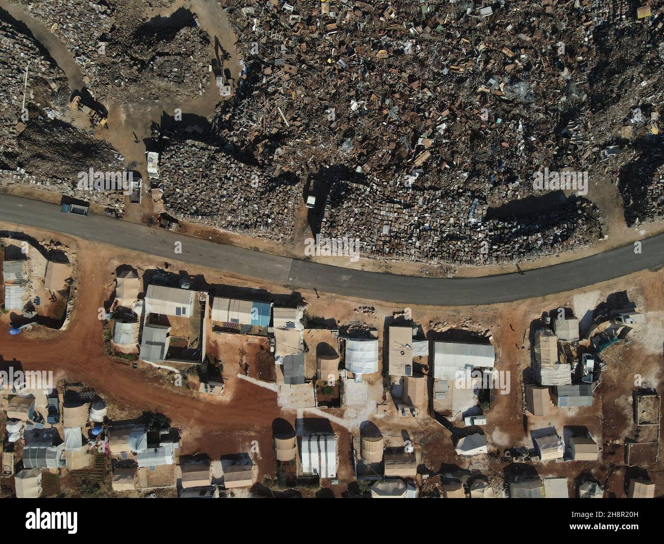 January 1, 1970, Al Mayd?n, Syria: (EDITOR'S NOTE : Image taken with drone) A scrapyard is seen near the tents of a IDP (internal displaced people) camp in north of Idlib. (Credit Image: © Omar Albam/SOPA Images via ZUMA Press Wire) Stock Photo