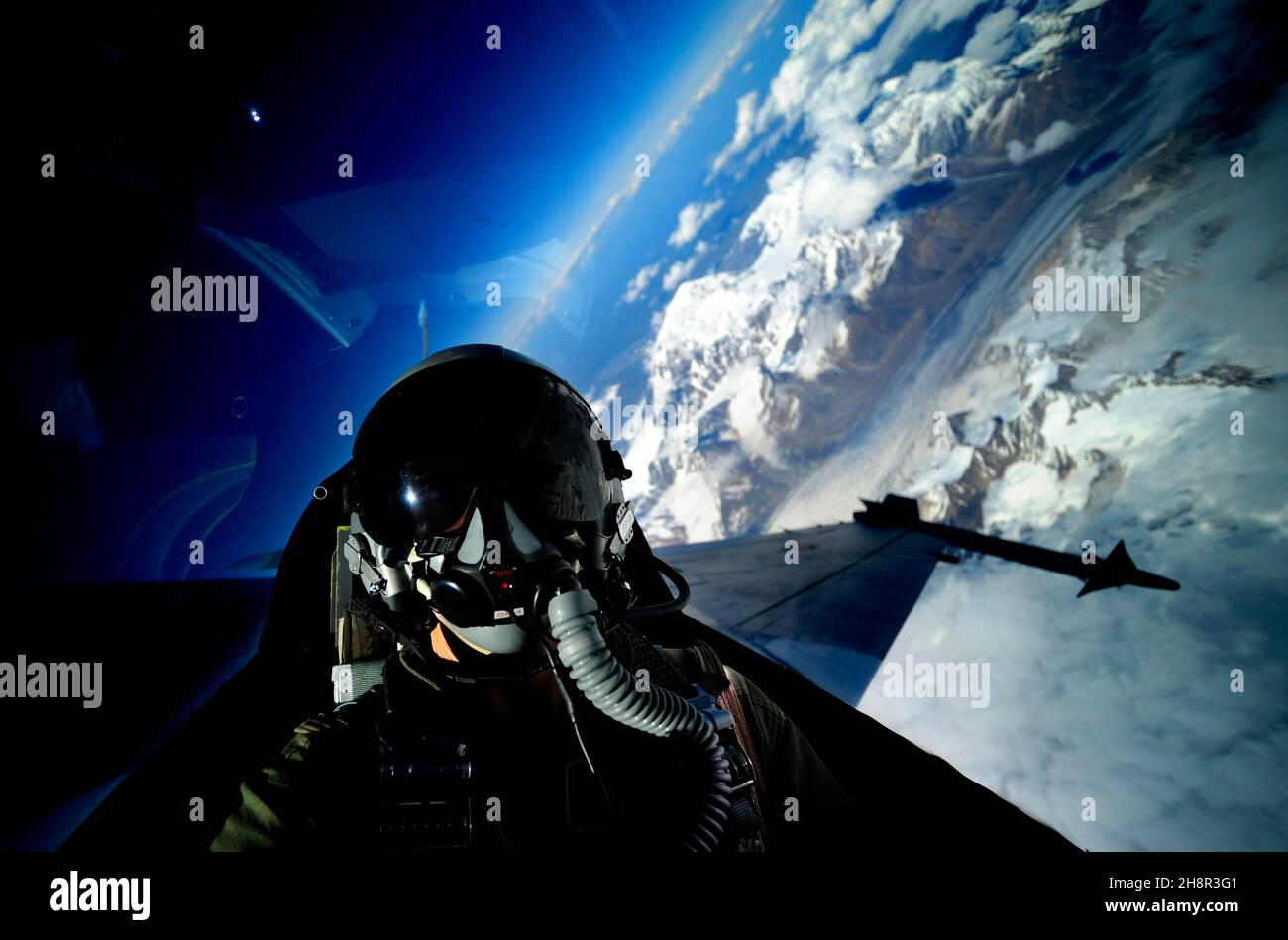 U.S. Air Force Tech. Sgt. James L. Harper Jr., from 1st Combat Camera Squadron, takes a self portrait in an F-16 Fighting Falcon from the 18th Aggressor Squadron June 24, 2010, during exercise Red Flag-Alaska. (U.S. Air Force photo by Tech. Sgt. James L. Harper Jr./Released) Stock Photo