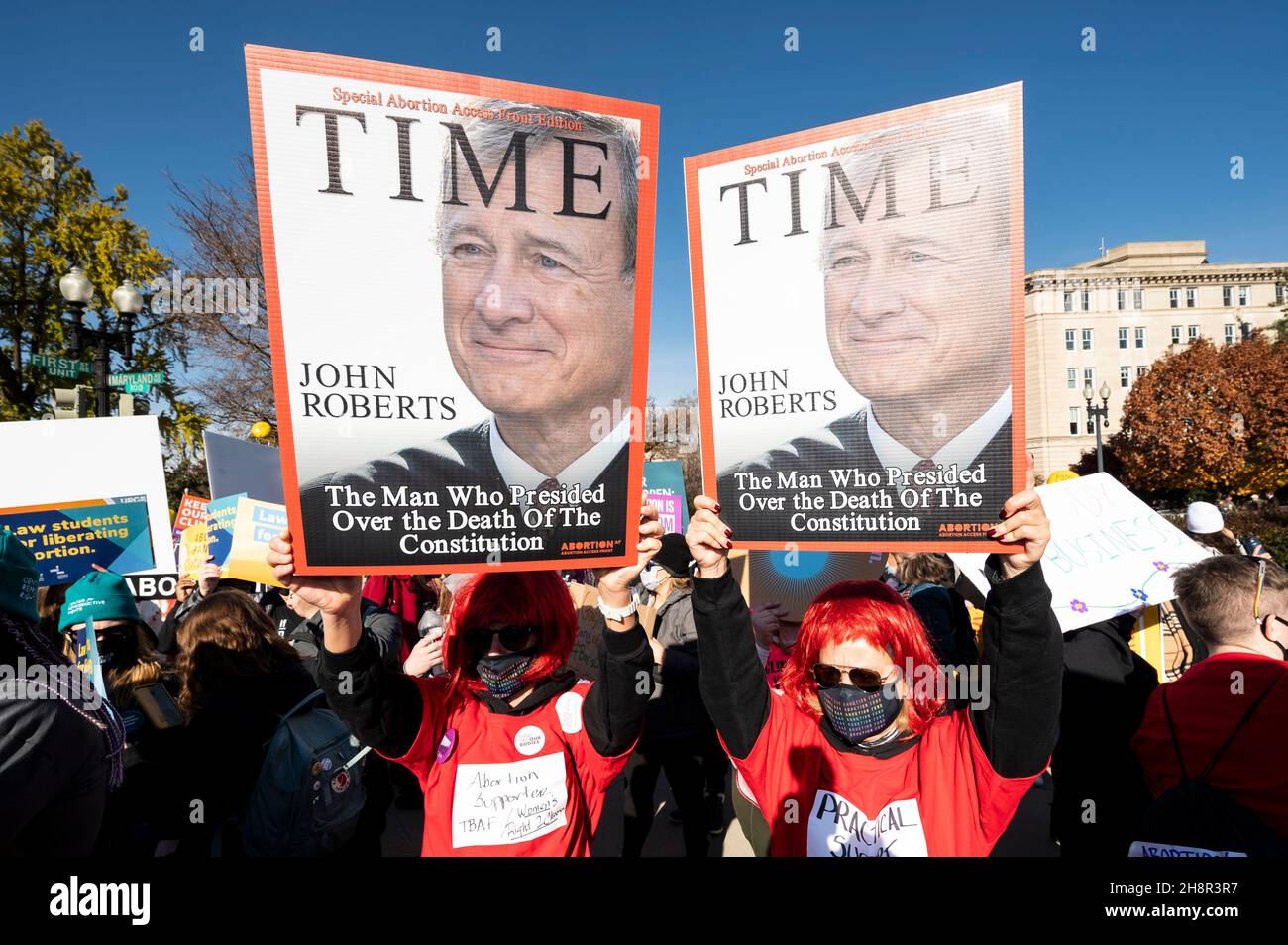 Washington, DC, USA. 1st Dec, 2021. December 1, 2021 - Washington, DC, United States: People holding up signs saying ''John Roberts, the man who presided over the death of the Consitution'' at a protest where a large number of pro-choice and pro-life protesters were outside the Supreme Court on the day it heard arguments regarding an abortion law in Mississippi. (Credit Image: © Michael Brochstein/ZUMA Press Wire) Stock Photo