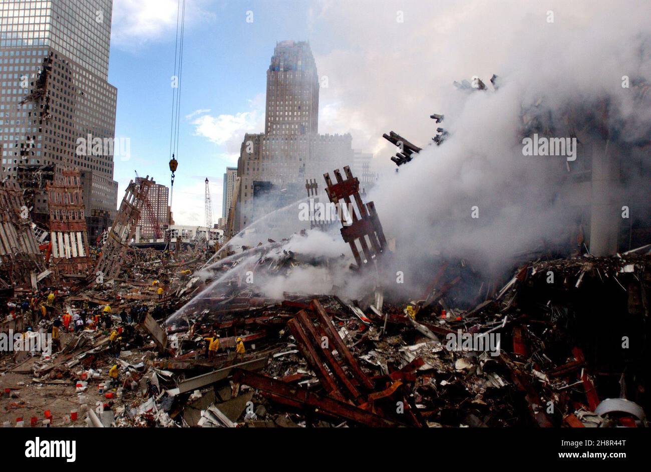 Fires still burn amidst the rubble and debris of the World Trade
