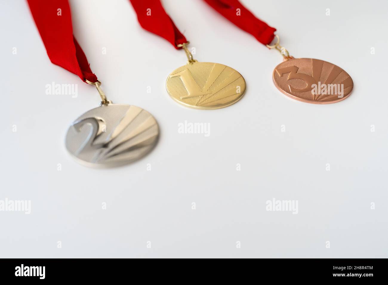 gold, silver and bronze medals with numbers on white isolated background for winners.Medal with