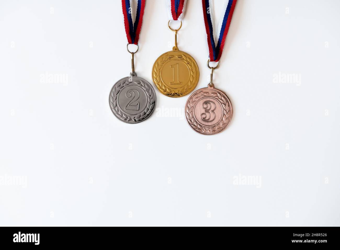 gold, silver and bronze medals with numbers on white isolated background for winners.Medal with