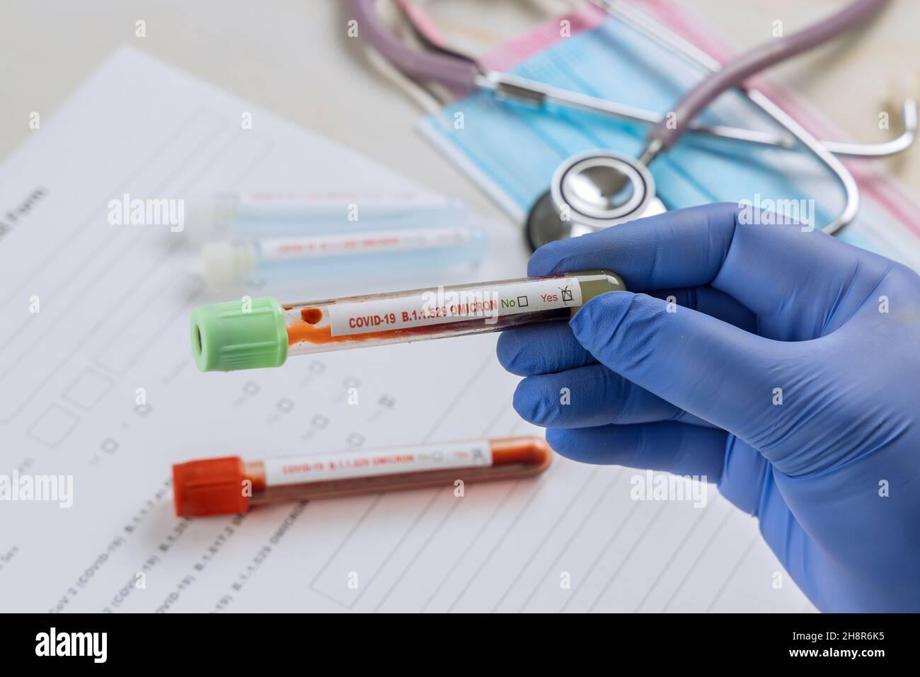 Tube containing a blood sample for COVID-19 that has tested positive of new version Omicron of coronavirus Stock Photo