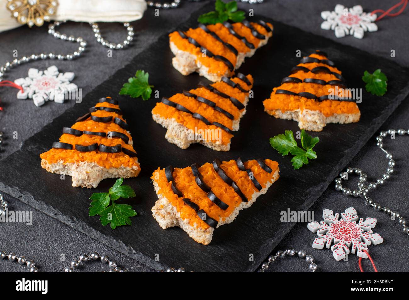 Christmas Food 2022 Sandwiches In Shaped Of Christmas Tree For New Year Tiger 2022 Of Carrot,  Cheese And Black Olives On White Bread On Gray Background Stock Photo -  Alamy