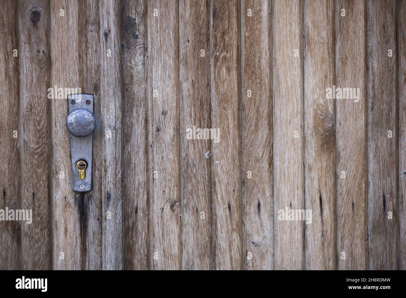 Closeup shot of a door lock on a wooden door Stock Photo - Alamy