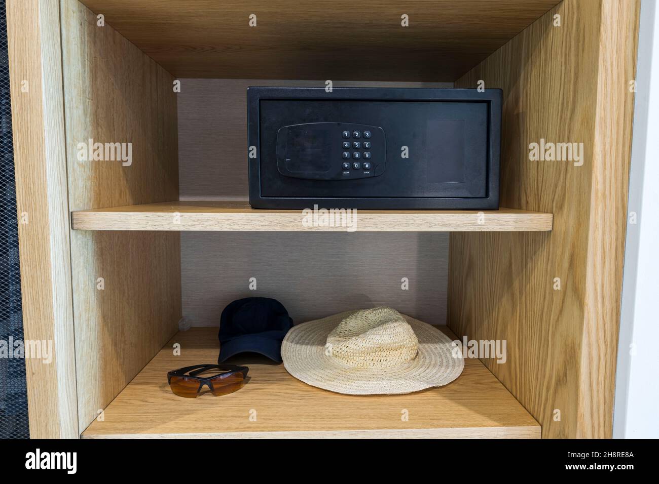 Close up interior view of belongings and safety deposit box in hotel's