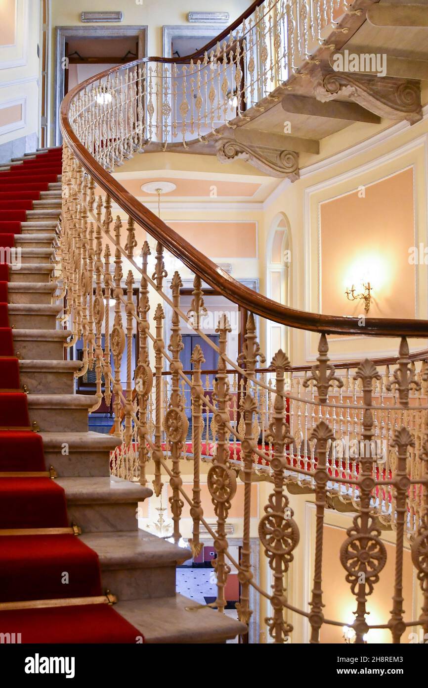 Glimpse of the elliptical staircase inside the historic Hotel Bristol Palace, famous for hosting Alfred Hitchcock, Genoa, Liguria, Italy Stock Photo