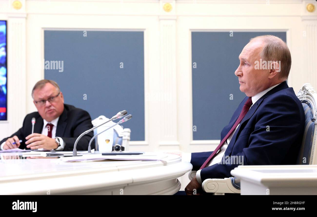 Moscow, Russia. 30 November, 2021. Russian President Vladimir Putin, right, and VTB Bank Chairman Andrei Kostin attend a virtual event with the annual VTB Capital 'Russia Calling!” Investment Forum November 30, 2021 in Moscow, Russia.  Credit: Mikhail Metzel/Kremlin Pool/Alamy Live News Stock Photo