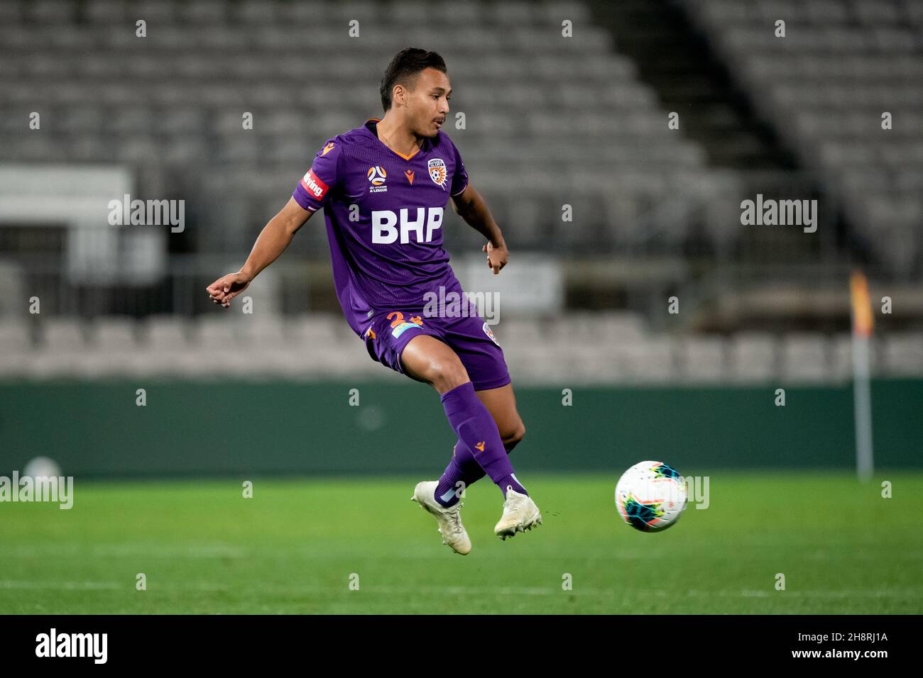 Perth Glory forward Dane Ingham (23) controls the ball Stock Photo