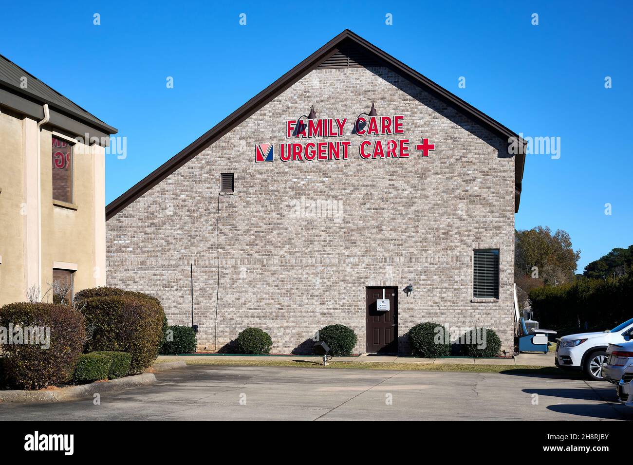 Family care or urgent care doctor's office exterior entrance with sign in Montgomery Alabama, USA. Stock Photo
