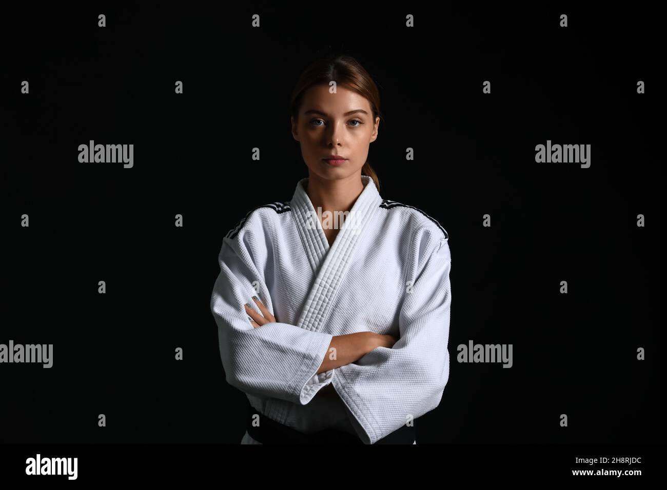 Female karate instructor on dark background Stock Photo Alamy