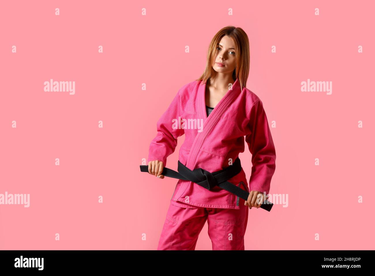 Female karate instructor on color background Stock Photo Alamy