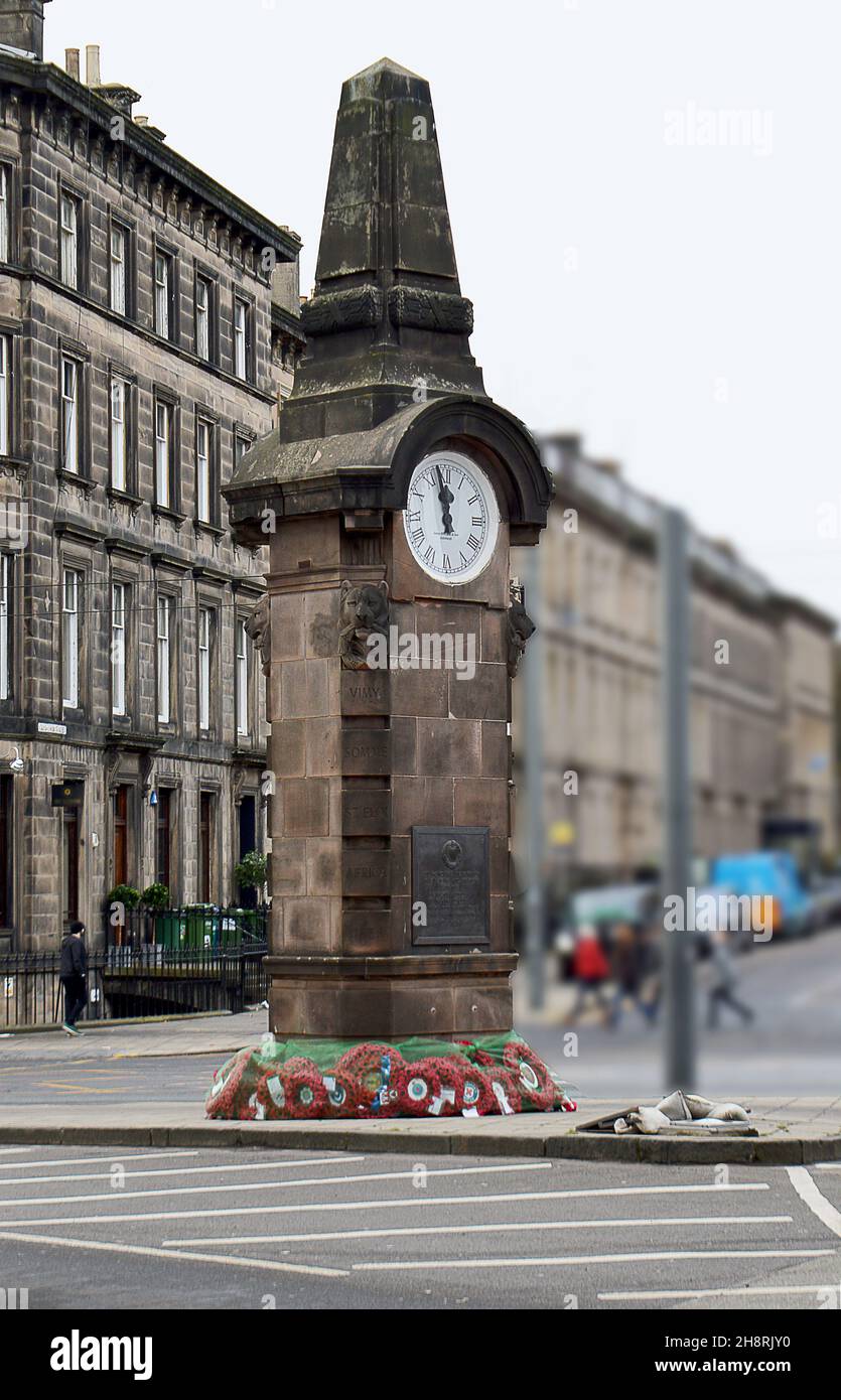 EDINBURGH, SCOTLAND - 29 NOVEMBER 2021: Poppy wreaths from supporters clubs surround the base of the Heart of Midlothian FC (Hearts) war memorial. Stock Photo