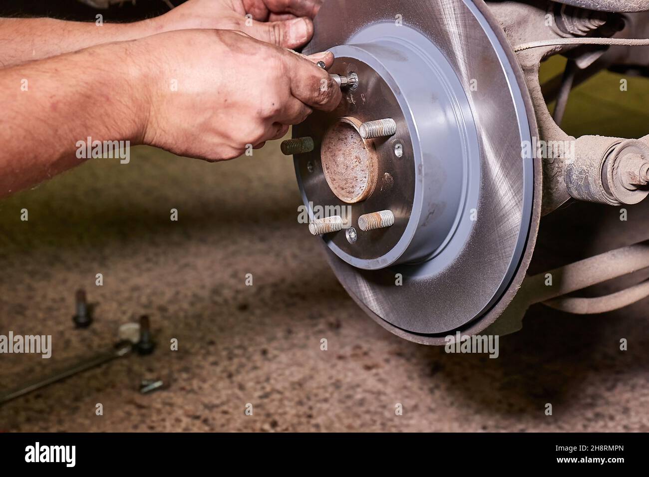 Changing brake rotor disc on a car Stock Photo