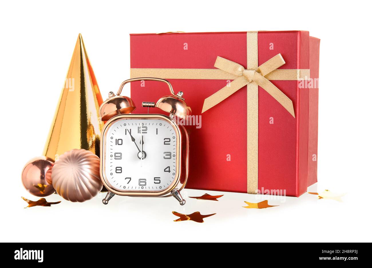 Composition with alarm clock, Christmas gift and decorations on white