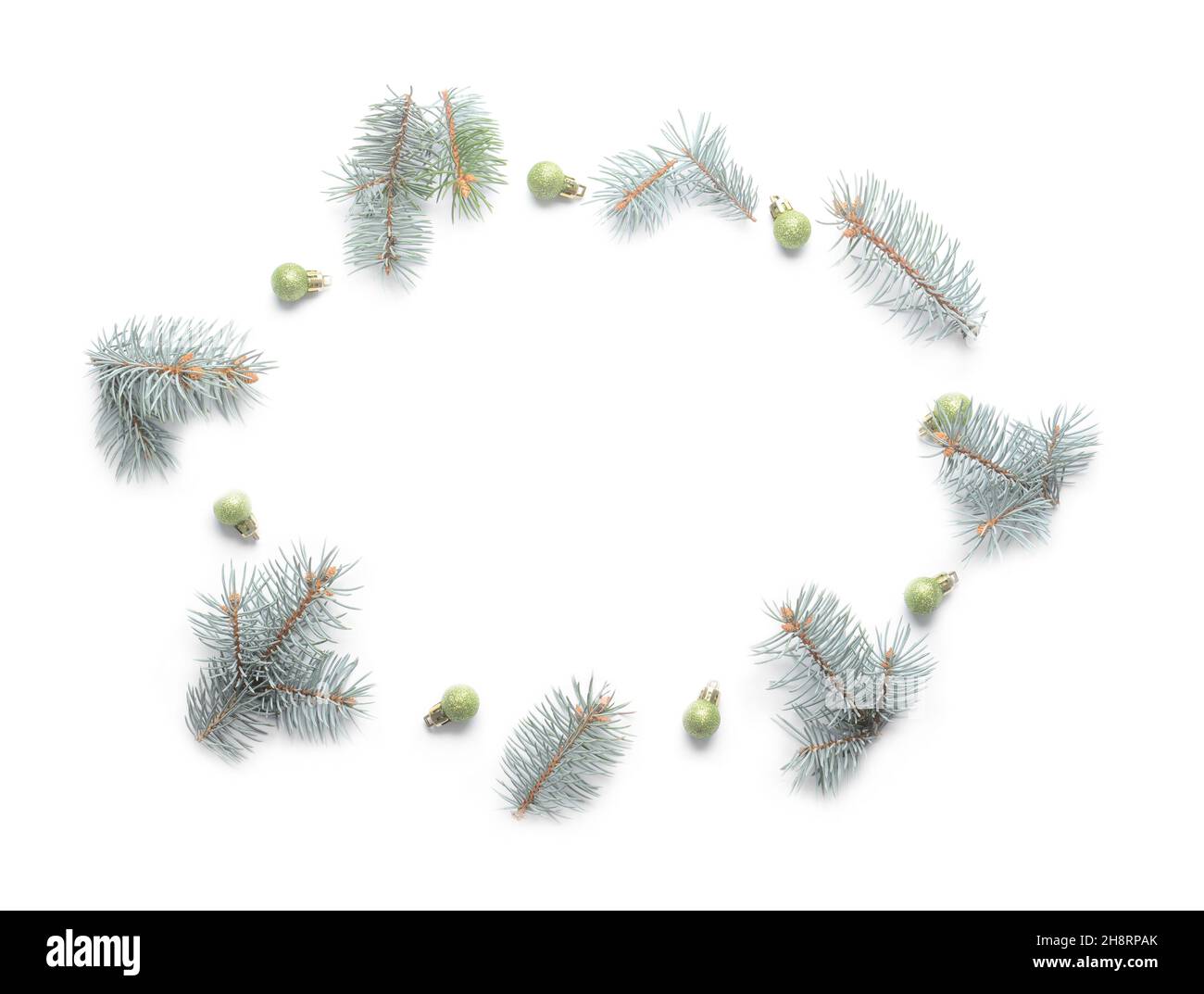 Frame made of fir branches and Christmas balls on white background ...