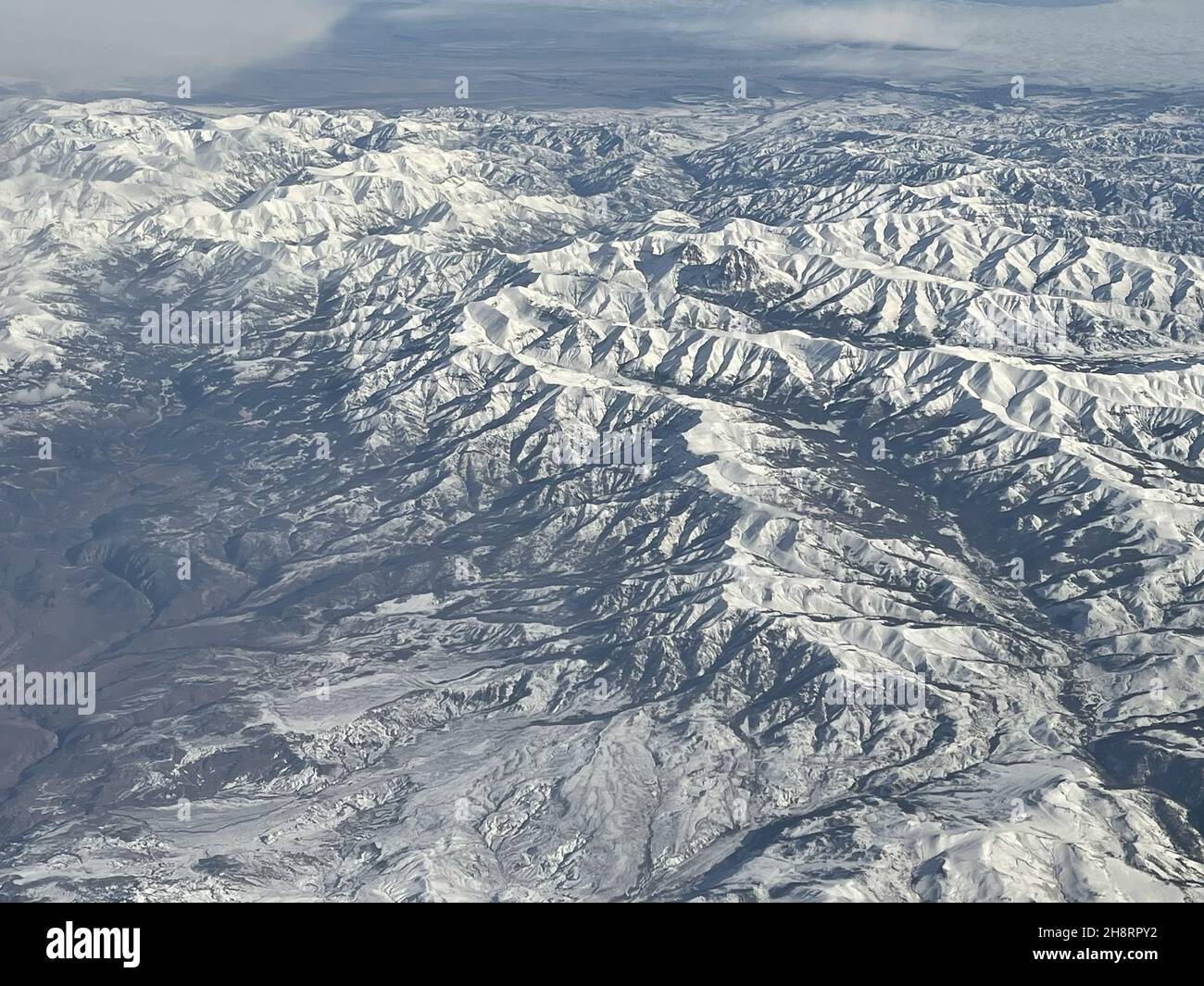 Aerial view of mountains covered in snow Stock Photo - Alamy