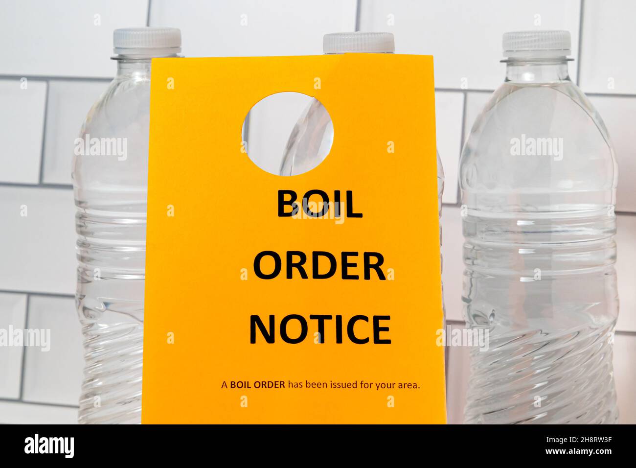 Boil order notice and bottled water. Clean, contaminated, dirty or broken drinking water supply concept. Stock Photo