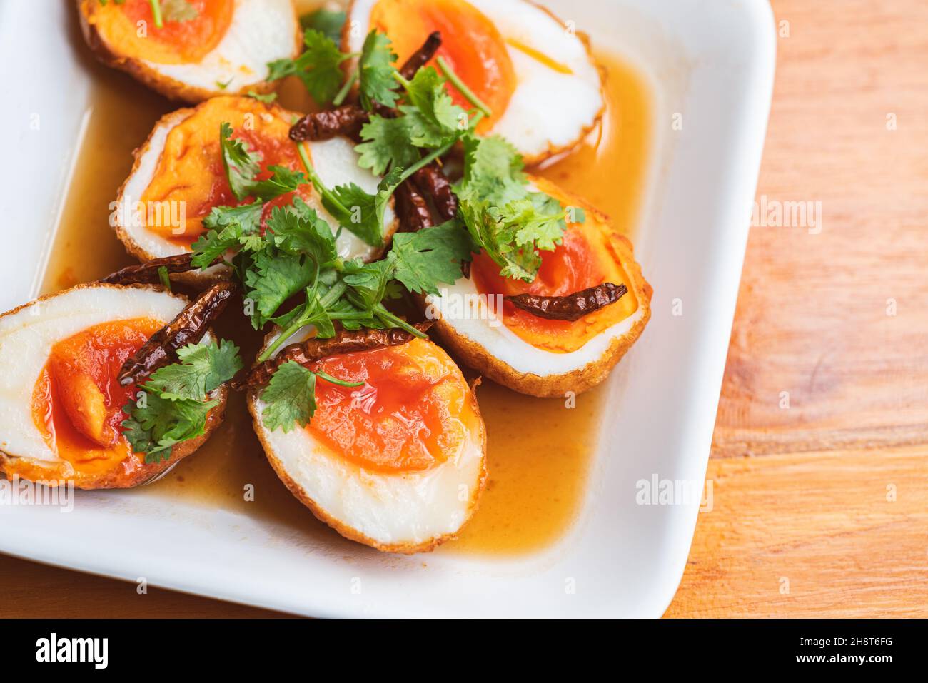 Top view Thai food, Fried boil chicken eggs with tamarind sauce, topped