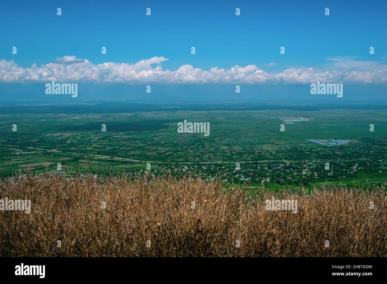 Scenic view of everlasting fields against cloudy skies in the town of Signagi. Kakheti Province, Georgia. Stock Photo